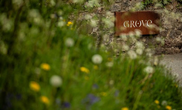 Hotel sign with flowers
